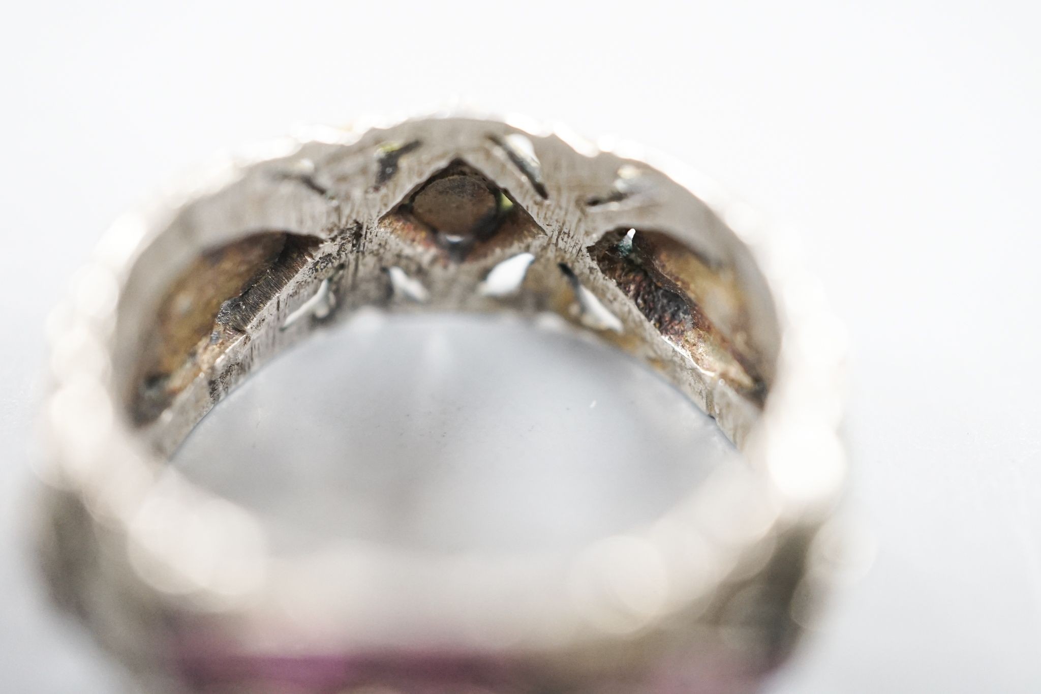 A 19th century Austro-Hungarian pierced white metal, diamond and gem set band, size W/X.